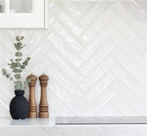 White Kitchen Backsplash With Two Vases