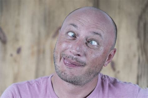 Handsome Caucasian Bald Man Making Funny Face Close Up Stock Photo