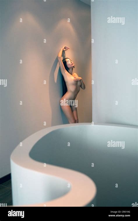 Nude Woman Leaning Against Wall Stock Photo Alamy