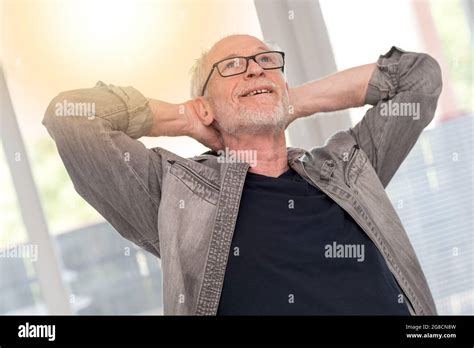Relaxed Mature Man Daydreaming Light Effect Stock Photo Alamy
