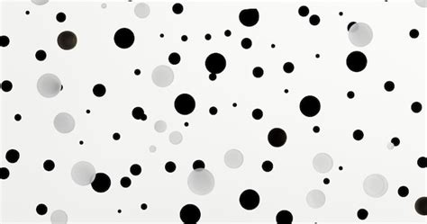 Premium Photo There Are Many Black And White Dots On A White