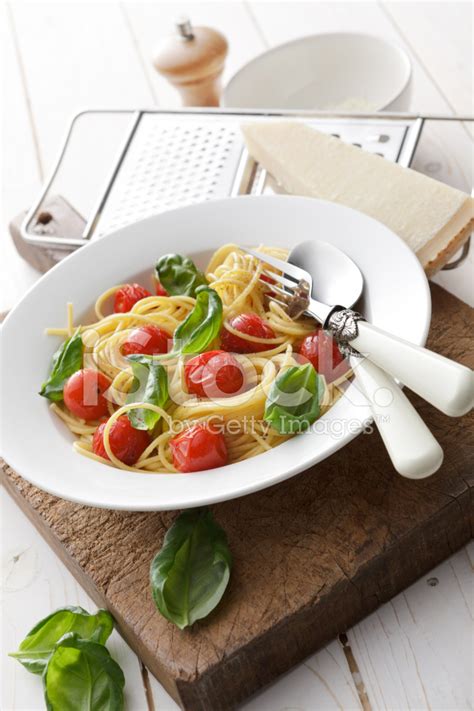 Italian Stills Spaghetti With Cherry Tomatoes And Basil Stock Photo