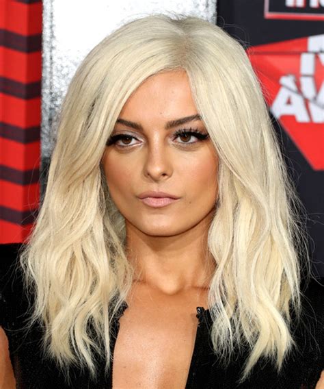 Bebe Rexha Long Wavy Light Blonde Hairstyle