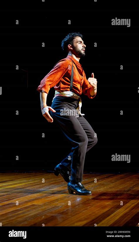 Focused Male Flamenco Dancer With Traditional Attire Performing On A