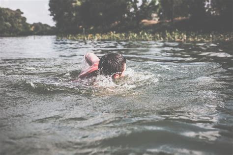 The Young Man Swimming in the River Stock Photo - Image of endurance, action: 158730870