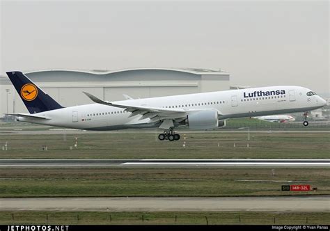 A Lufthansa Airplane Taking Off From An Airport Runway