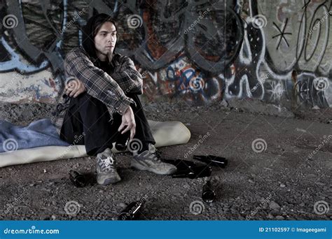 Homeless Man Drinking Alcohol From A Bottle Stock Photo Cartoondealer