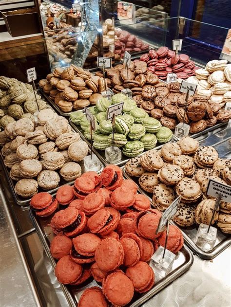 A Display Case Filled With Lots Of Different Types Of Cookies And