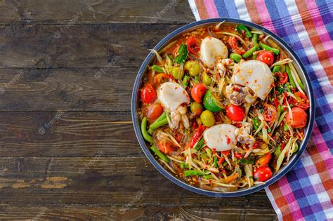 Premium Photo Som Tam Seafood Squid Spicy Papaya Salad With Salted