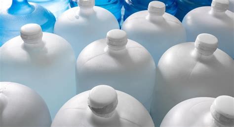 Premium Photo Plastic Big Bottles Or White And Blue Gallons Of