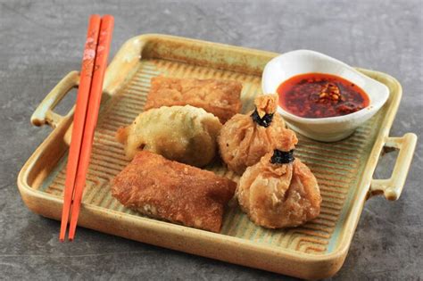 Premium Photo Deep Fried Dim Sum Ekado Lumpia On Rustic Square