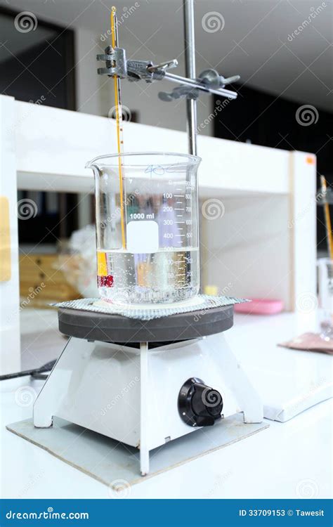 Beaker With Water Warming On Hot Plate Stock Image Image Of Closeup Metal