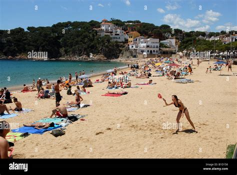 Holiday makers on the beach at Llafranc on the Costa Brava Spain Stock ...