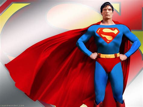 a man in a superman costume standing with his hands on his hips