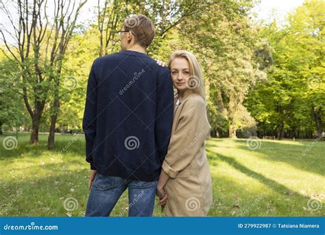 Wife And Husband Walk In Park Woman Leans Head To Manand X27s Shoulder Stock Image Image Of