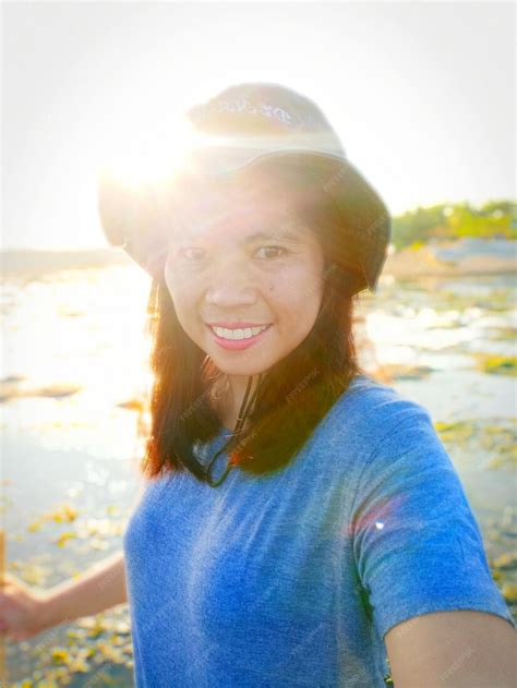 premium photo portrait  smiling woman  beach