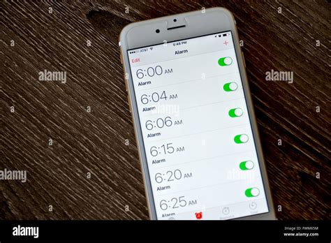 An Apple Iphone 6s Displaying The Alarm Clock Application With Multiple