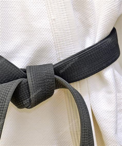 Karate Black Belt on White Uniform Stock Photo by ©Nyker 47688369