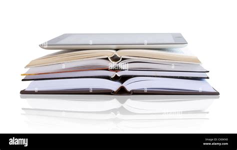 Compare a tablet and books Stock Photo - Alamy