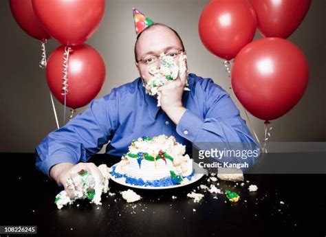 Fat Man Eating Cake Photos And Premium High Res Pictures Getty Images