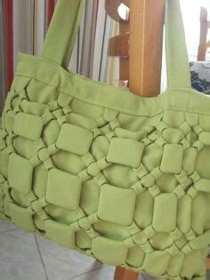 A Green Purse Sitting On Top Of A Wooden Chair