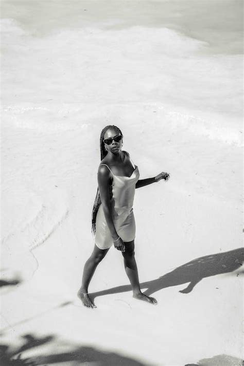 Woman Posing on Beach in Black and White · Free Stock Photo