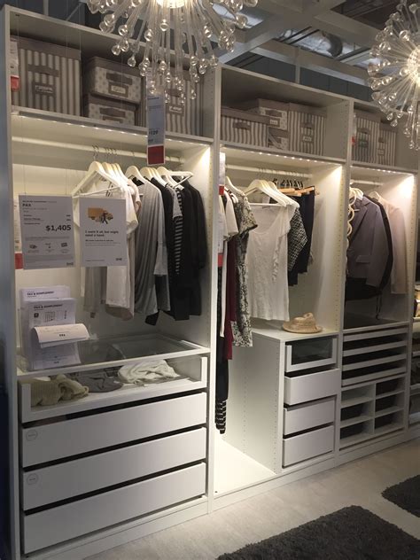 An Open Closet With Clothes And Other Items On Display In The Store S