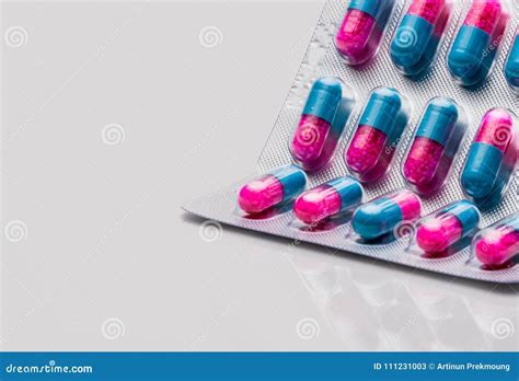 Colorful of Blue, Pink Capsule with Granule in Side Pills. Pills in Blister Pack on White ...