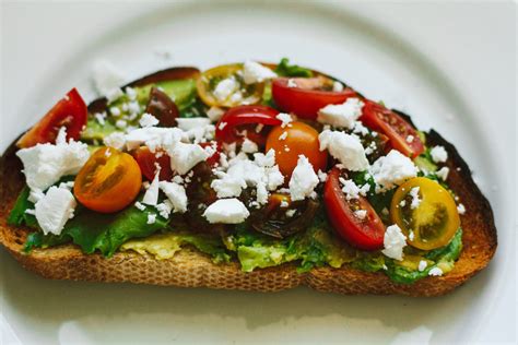 Avocado Toast With Heirloom Cherry Tomatoes Vegan Feta Arugula And A