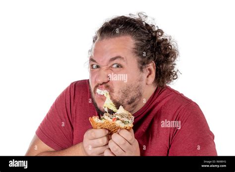 Funny fat man eating hamburger. Fast food, unhealty eat Stock Photo - Alamy