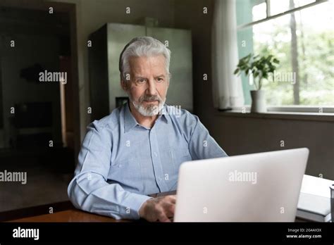 Mature Adult Laptop Desk Home Hi Res Stock Photography And Images Alamy