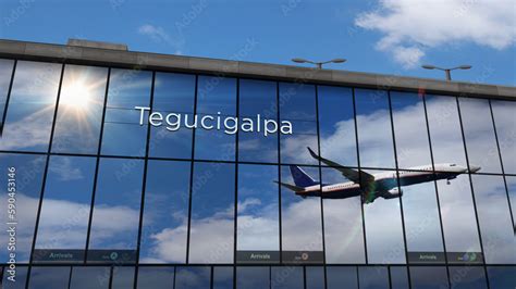 Airplane landing at Tegucigalpa Honduras airport mirrored in terminal ...