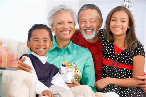 An african-american grandparents with their grandchildren celebrating ...