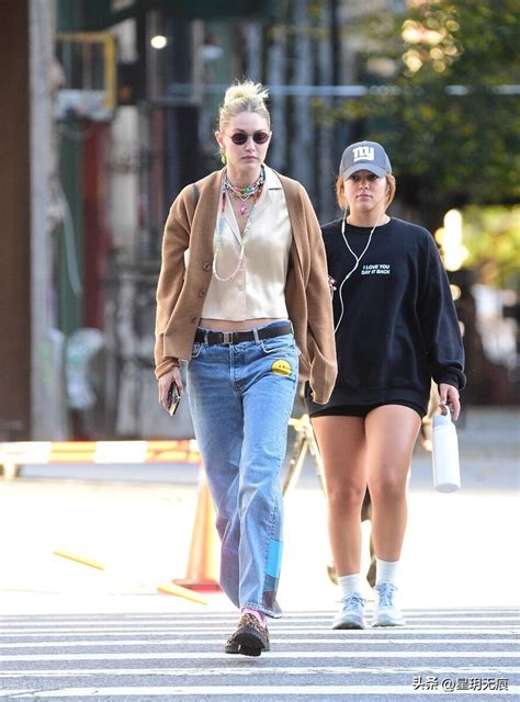 Gigi Hadid Wears Brown Knitted Cardigan Jeans Satin Shirt Leopard