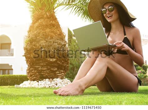 Sexy Girl Black Bikini Sits On Stock Photo 1119671450 Shutterstock