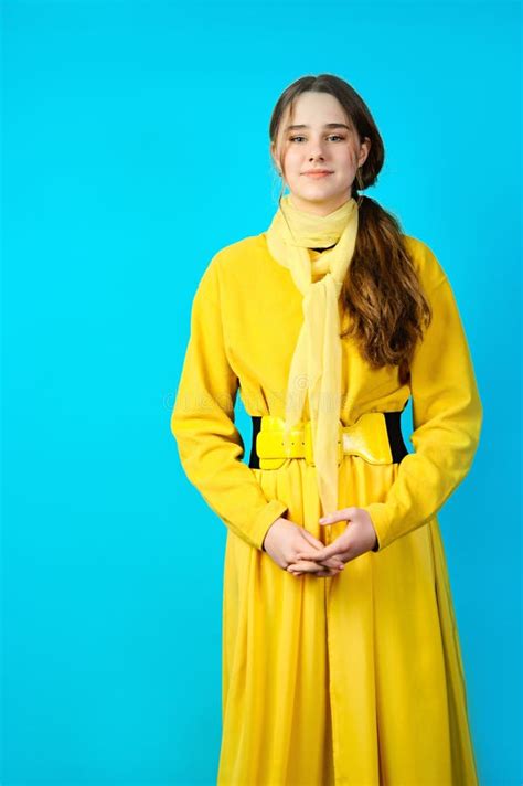 Girl Teenager In Yellow Clothes Makes Gesture With Her Fingers Blue