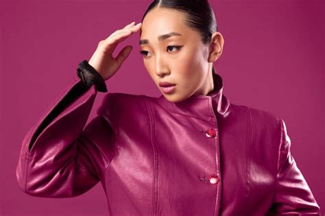 Premium Photo Fashion Asian Brunette Woman Wearing A Purple Leather Jacket Posing With Eyes