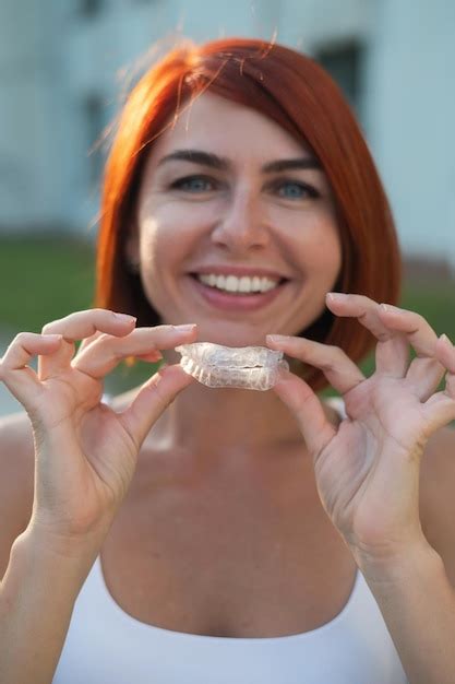 Premium Photo Cropped Image Of Woman Holding Flower