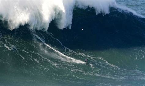 Surfer at Nazare rides estimated 100-foot wave; might be a world record