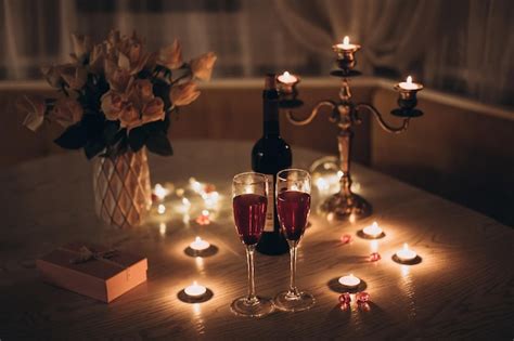 Premium Photo Candlelight Date Glasses With Wine Candles Bouquet Of