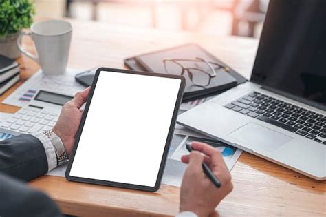 Premium Photo Cropped Shot Of Businessman Hand Holding Blank Screen