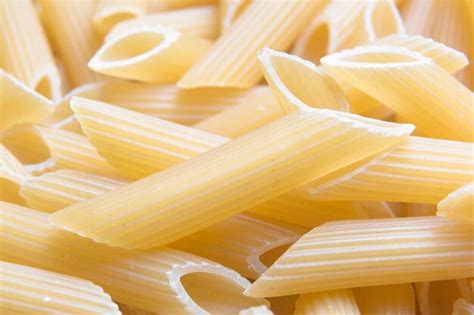 Premium Photo Italian Penne Rigate Macaroni Macro Pasta Raw Food