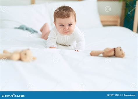 adorable toddler crawling  bed  bedroom stock image image