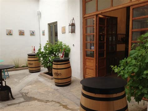 Two Wine Barrels Sitting On Top Of A Patio