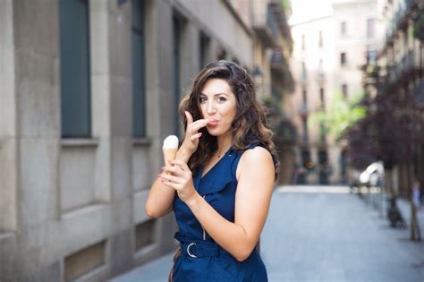 Free Photo Happy Woman Licking Finger While Eating Ice Cream