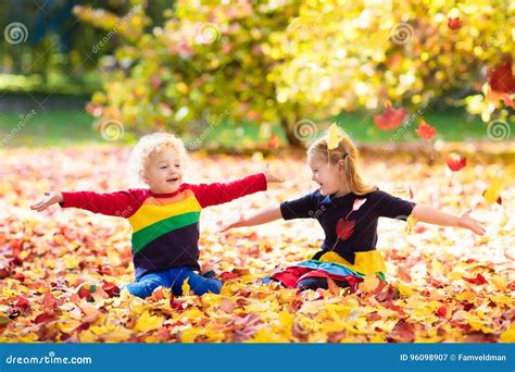 Kids Play In Autumn Park Children In Fall Stock Image Image Of Girl