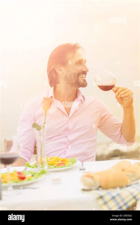 Handsome Man Drinking Wine Stock Photo Alamy