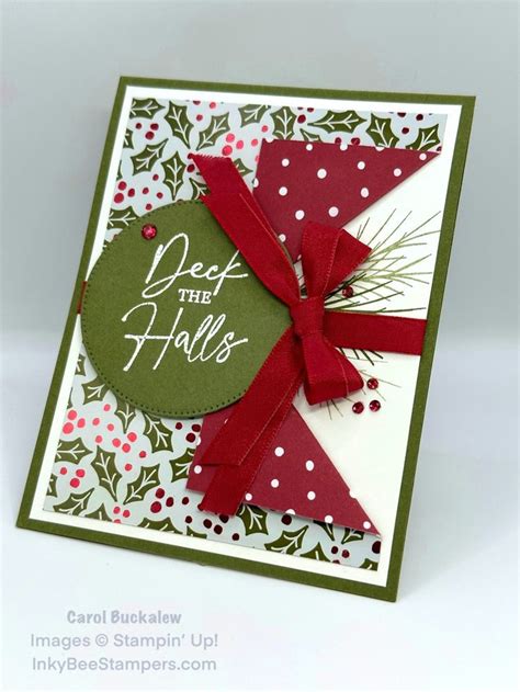 A Close Up Of A Christmas Card With A Bow On The Front And Green Background