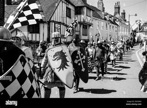 People In Medieval Costume March Through The Streets Of Lewes During