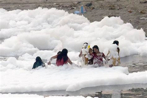 Photos Chhath Puja Begins With A Foamy Dip In Yamuna